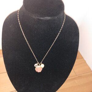 Lia Sophia: gold tone chain necklace with pink flower pendant.